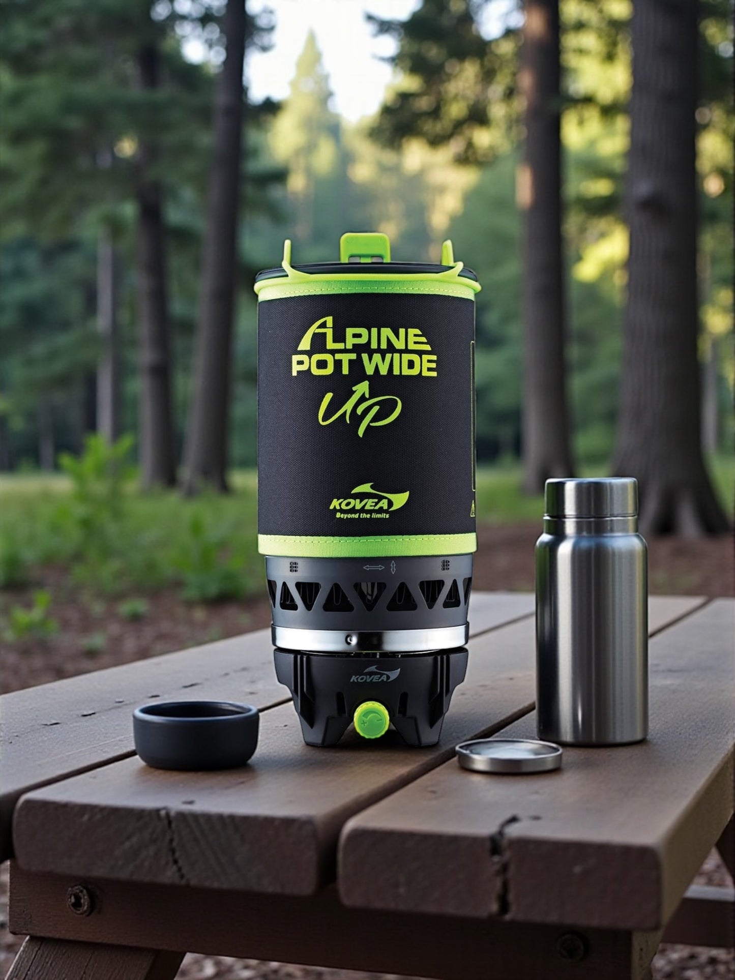 Kovea Alpine Pot Wide on a wooden table with a forest background