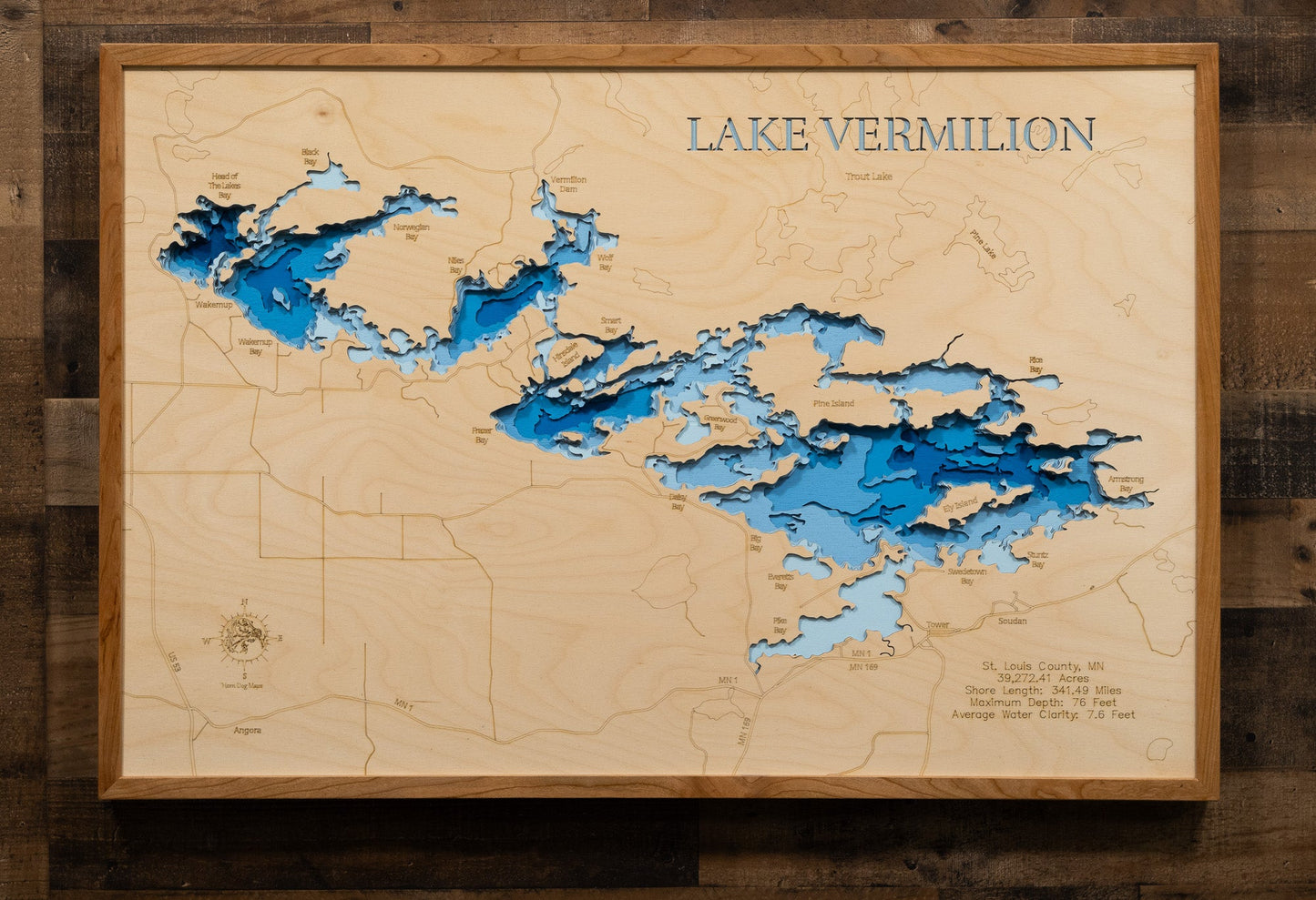 Wooden map of Lake Vermilion with raised relief details on a wooden background